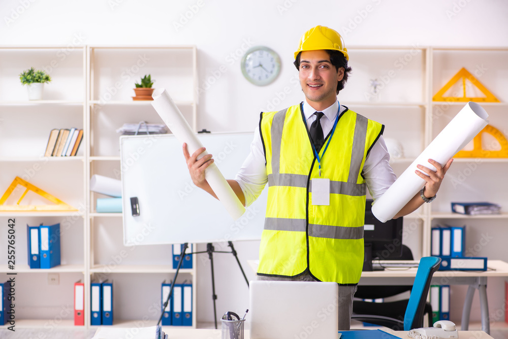 Male construction engineer working in the office Male construction engineer working in the office