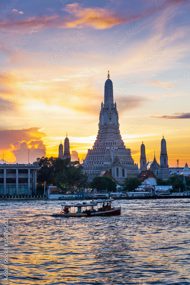 Sunset silhouette of Wat Arun (Temple of Dawn) is the famous landmark landmark of Attractions's Popular tourists, in Chao Phraya river, bangkok Thailand