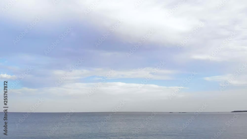 Aerial Shot: Flying backwards over the blue sea water and reaching the beach Aerial Shot: Flying backwards over the blue sea water and reaching the beach