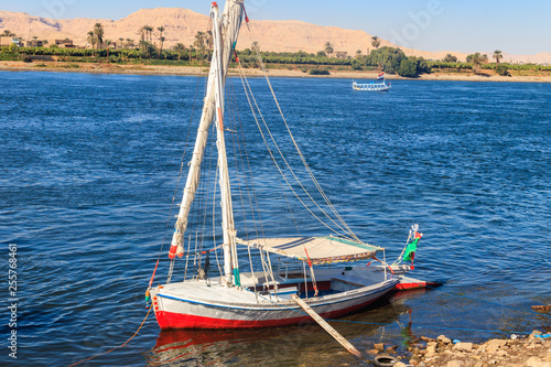 Felucca boat moored near the shore of Nile river in Luxor  Egypt