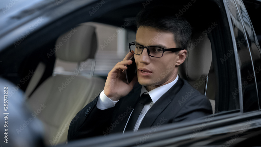 Worried businessman talking on phone, finding out about his bankruptcy, problems