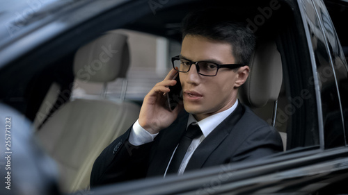 Worried businessman talking on phone, finding out about his bankruptcy, problems © motortion