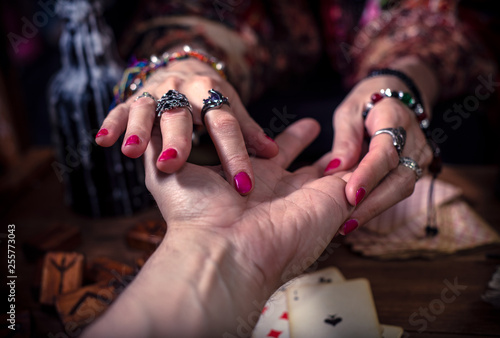 Gypsy fortune teller predicts the future with chiromancy