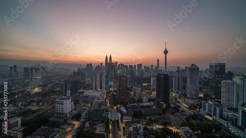 KUALA LUMPUR, MALAYSIA - MARCH 17, 2019: 4K Cinematic Sunrise Time Lapse Footage of Kuala Lumpur city skyline from the west side of the Malaysian capital.