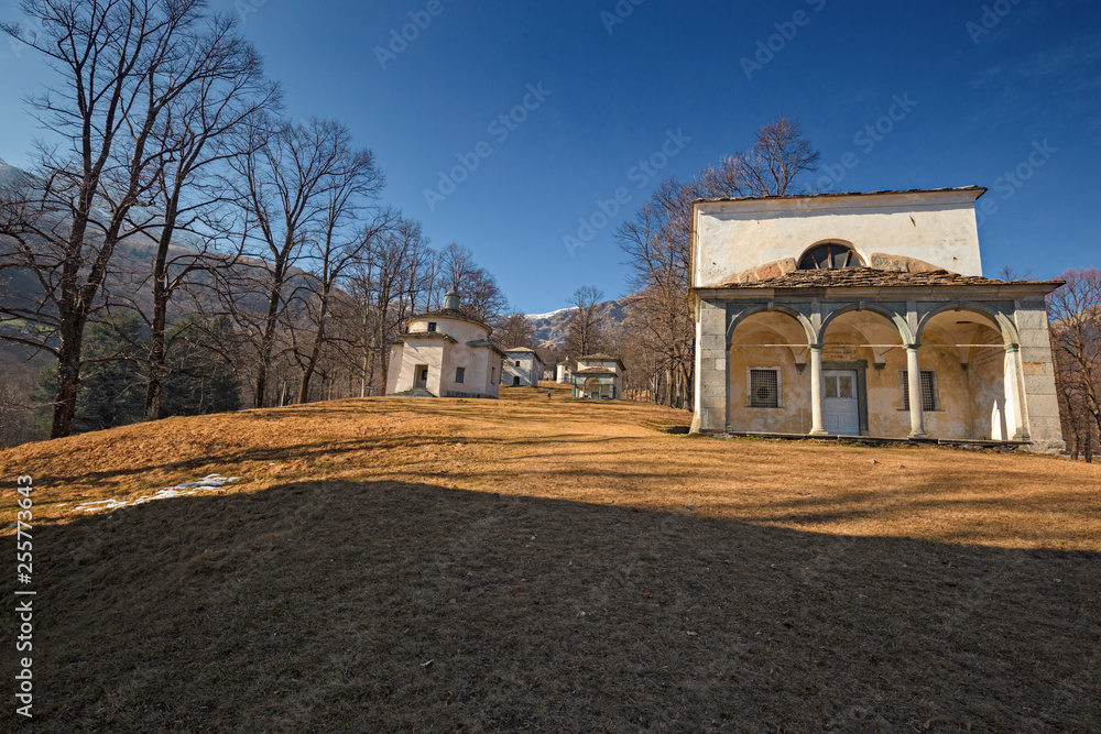 Panoramic view in the afternoon light on a winter day, of the seventeenth-century chapels of the monumental complex dedicated to the Virgin Mary, of the Sanctuary of Oropa in Piedmont, Italy.