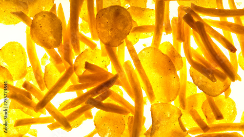 Fotografi French fries and chips on white background, concept of harmful salty food