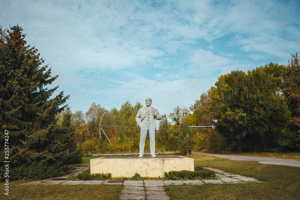 Monument to Lenin in Chornobyl exclusion zone. Radioactive zone in Pripyat city - abandoned ghost town. Chernobyl history of catastrophe. Lost place in Ukraine, USSR