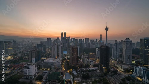 KUALA LUMPUR, MALAYSIA - MARCH 17, 2019: 4K Cinematic Sunrise Time Lapse Footage of Kuala Lumpur city skyline from the west side of the Malaysian capital.