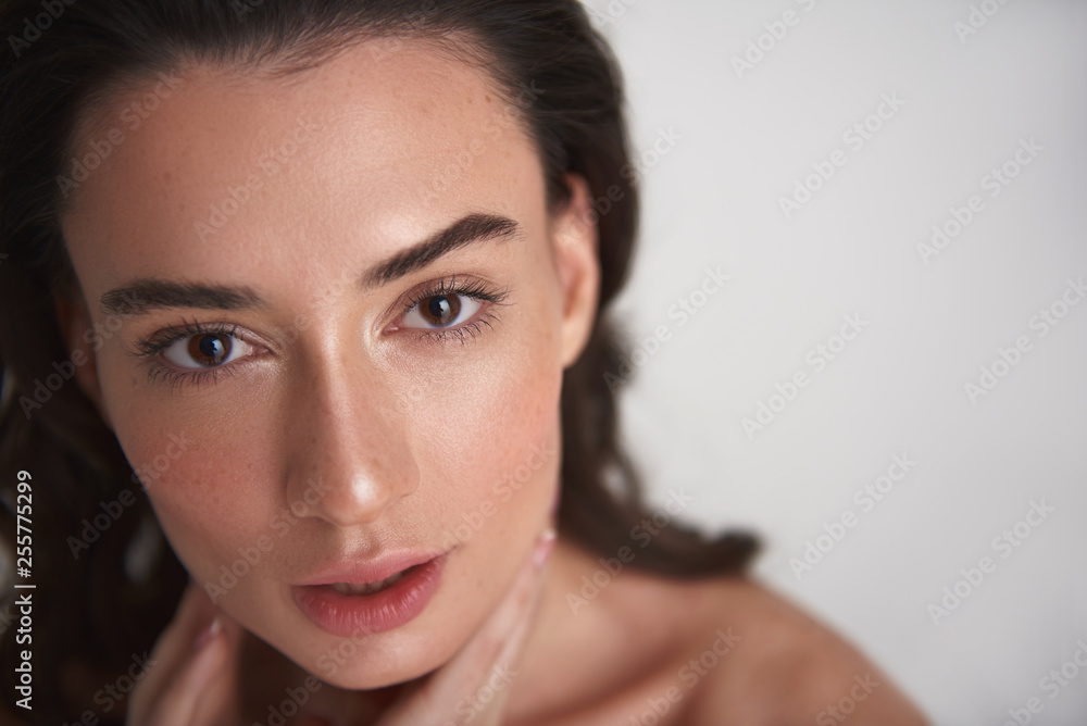 Naklejka premium Sensual portrait of young pretty brunette woman