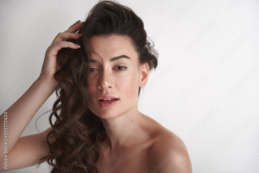 Fototapeta premium Portrait of young womanly naked brunette woman