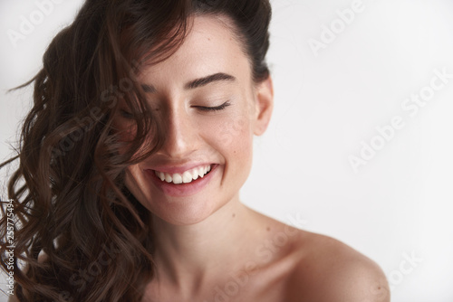 Close up of young smiling brunette woman