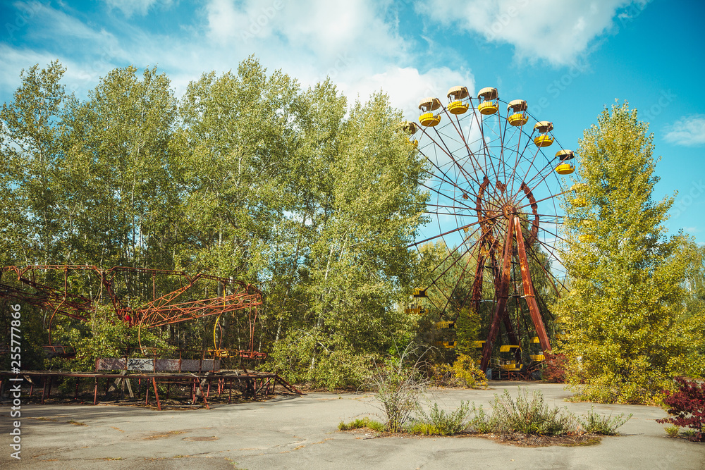 Abandoned amusement park in the city center of Prypiat in Chornobyl exclusion zone. Radioactive zone in Pripyat city - abandoned ghost town. Chernobyl history of catastrophe