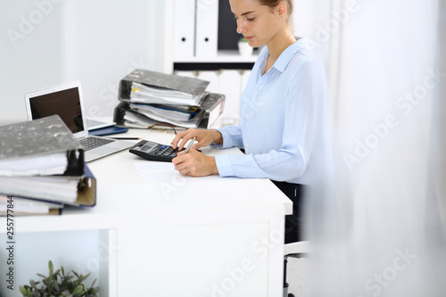 Wallpaper Mural Unknown female bookkeeper or financial inspector calculating or checking balance, making report, close-up. Internal Revenue Service at work with financial document. Tax and audit concept Torontodigital.ca
