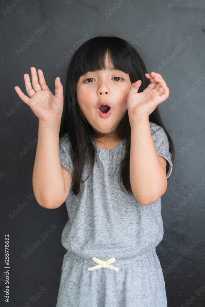 pretty caucasian girl kid fun and naughty pose photo shoot black wall background pretty caucasian girl kid fun and naughty pose photo shoot black wall background