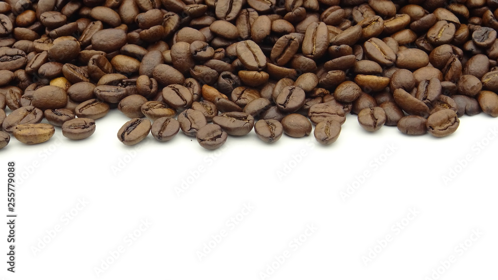 Close up of roasted coffee beans on white background Close up of roasted coffee beans on white background