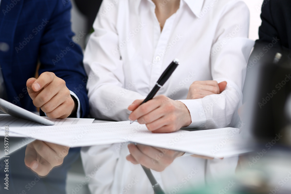 Businessman using laptop at meeting, closeup of hands. Business operations concept Businessman using laptop at meeting, closeup of hands. Business operations concept