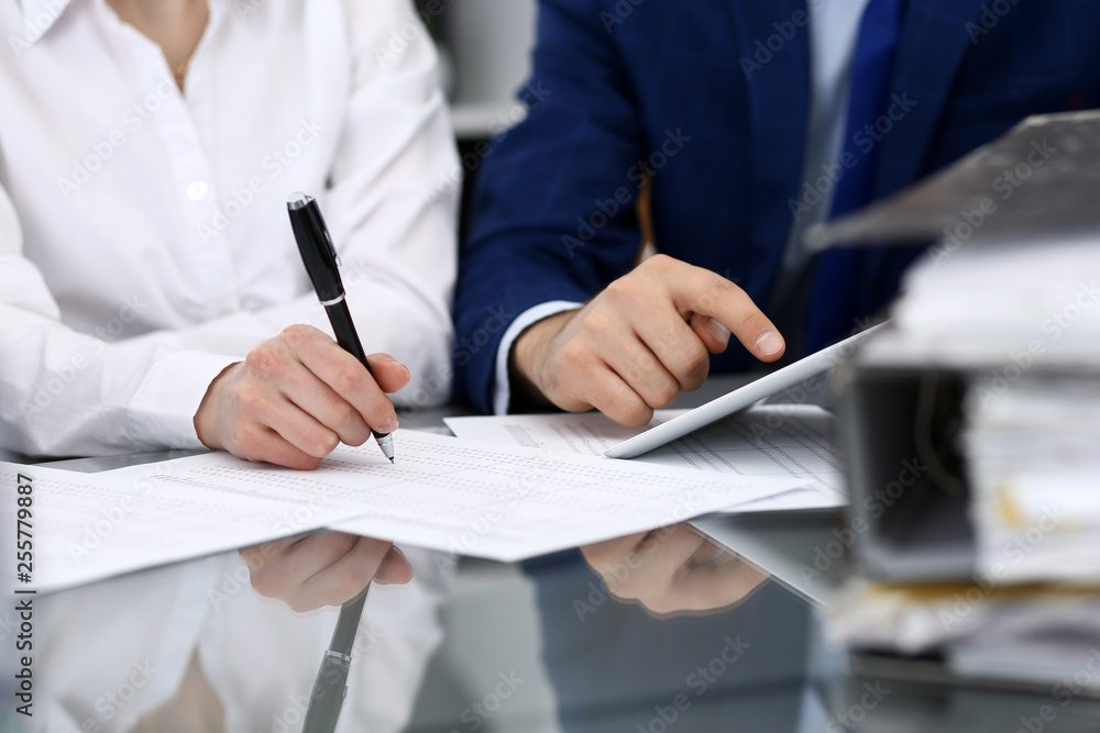 Businessman using laptop at meeting, closeup of hands. Business operations concept Businessman using laptop at meeting, closeup of hands. Business operations concept