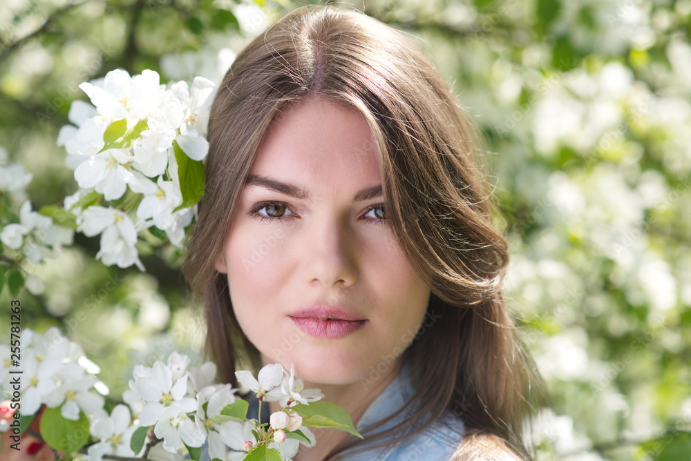 Woman near blooming apple tree Woman near blooming apple tree