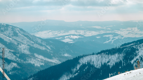 Jasna resort, LIPTOV, SLOVAKIA - February, 2019: Blue sky with snow clouds and new modern lift Funitel in Jasna, Liptov region, Slovakia.