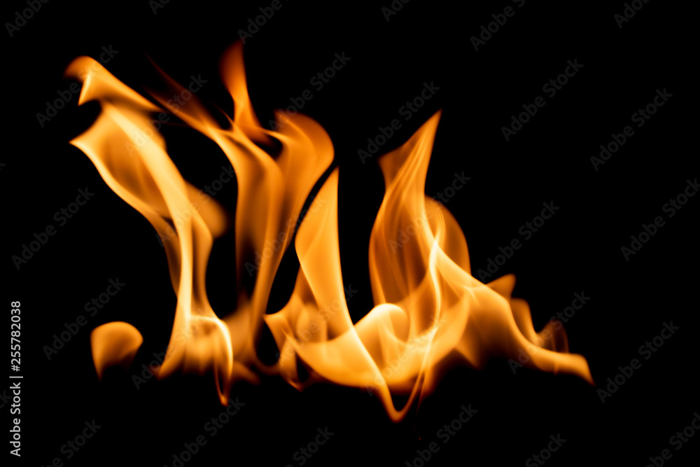 Bright orange flame isolated on black background Bright orange flame isolated on black background