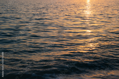 Peaceful ocean water during calm sunset 