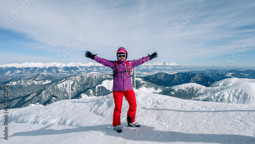 Women skier finding the best track. Skier looking down to the valley. Waiting for right moment. Best choice. Chopok, Low Tatras, Slovakia.