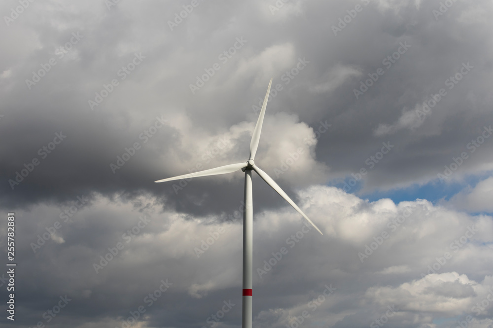 dramatic storm clouds around a windmill dramatic storm clouds around a windmill