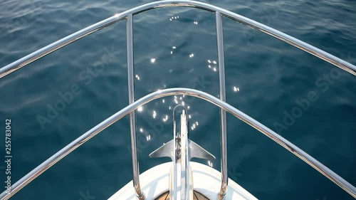 Detail of the bow of a yacht cruising.