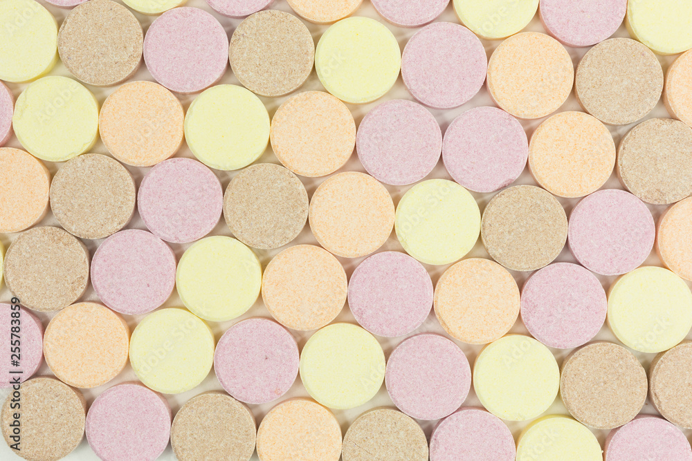 background of sweet sugar candy tablets with popping candy background of sweet sugar candy tablets with popping candy