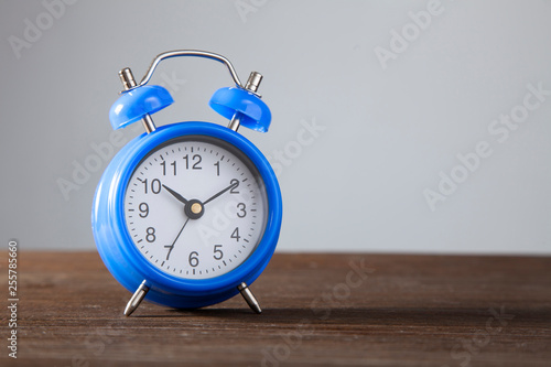 green alarm clock morning time