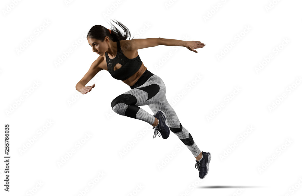 Woman sprinter leaving starting Woman sprinter leaving starting