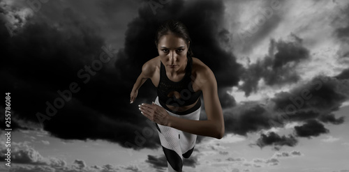 Woman sprinter leaving starting © Andrey Burmakin