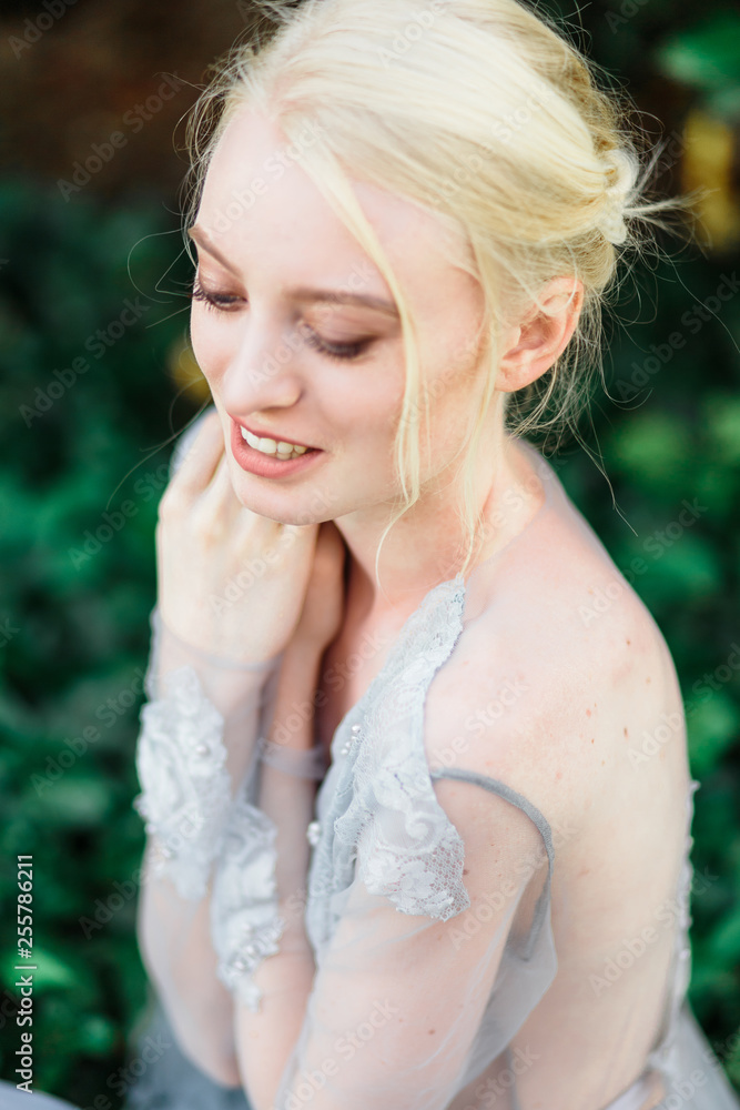 Stunning bride portrait in beautiful wedding dress on natural background. Stunning bride portrait in beautiful wedding dress on natural background.
