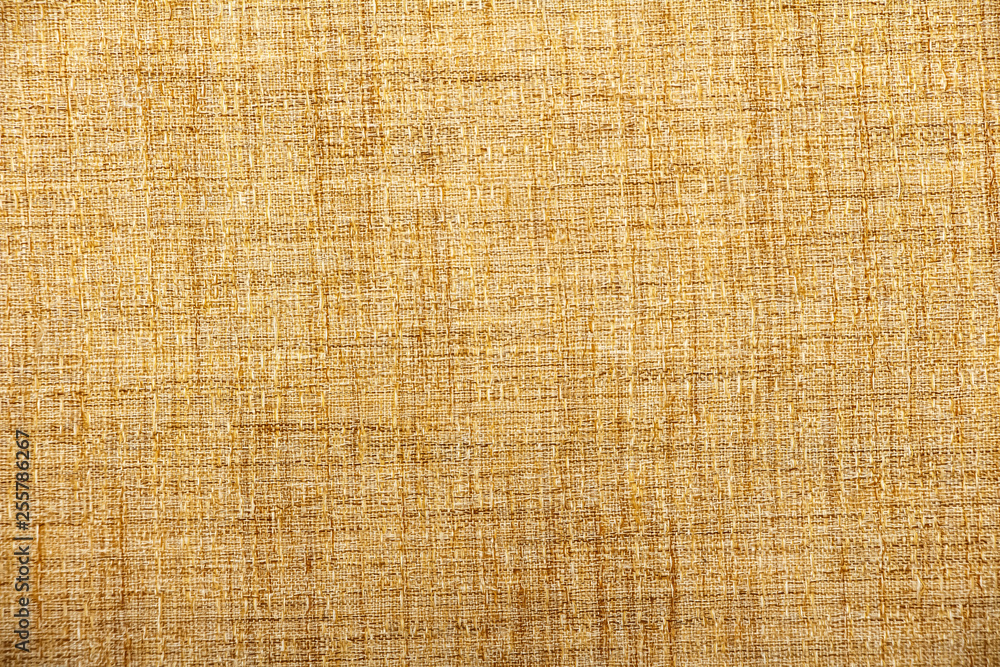 Hessian sackcloth burlap woven texture background / cotton woven fabric background with flecks of varying colors of beige and brown. with copy space. office desk concept. Hessian sackcloth burlap woven texture background / cotton woven fabric background with flecks of varying colors of beige and brown. with copy space. office desk concept.