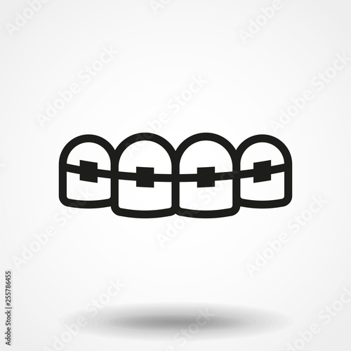 Tooth with braces vector icon.