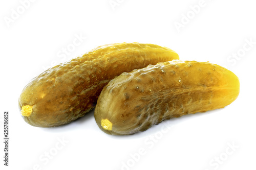 Pickled cucumbers isolated on a white background. Two pickled cucumbers isolated on a white background. Pickled cucumbers isolated. Crispy pickled cucumbers. 