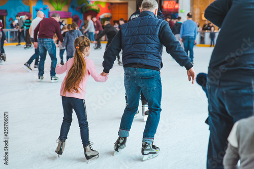 Obraz na płótnie LVIV, UKRAINE - February 3, 2019: people skating on ski rink in city mall w salonie