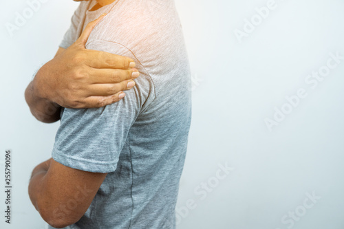 Man with pain in shoulder and upper arm, Ache in human body , closeup photo