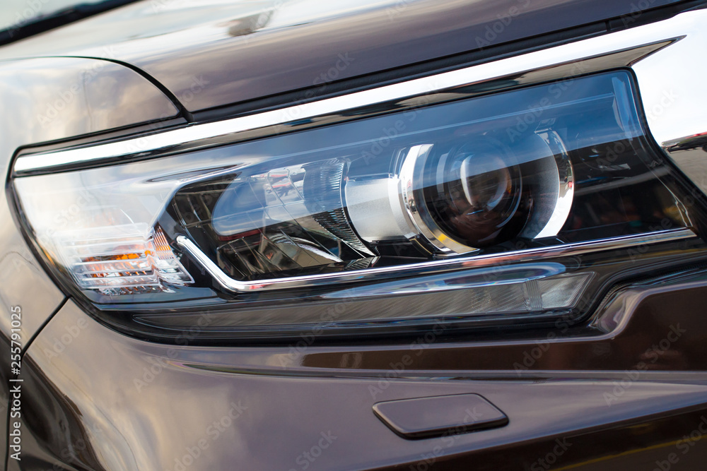 Closeup of car headlight - front view