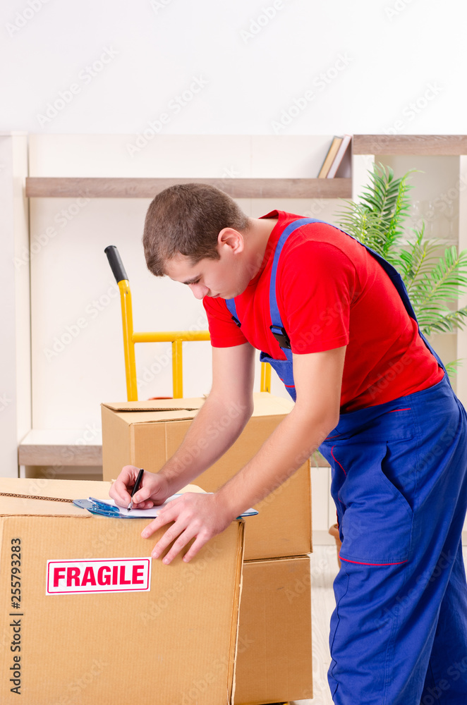 Young contractor with boxes working indoors Young contractor with boxes working indoors