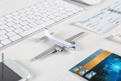 Composition with airplane model on table. Travel agency concept