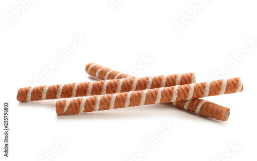 Tasty wafer roll sticks on white background. Crispy food