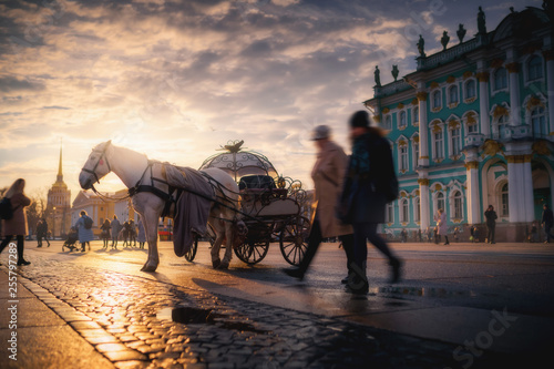 Horse coach at Palace Square near Hermitage museum. Saint Petersburg, Russia in the sunset
