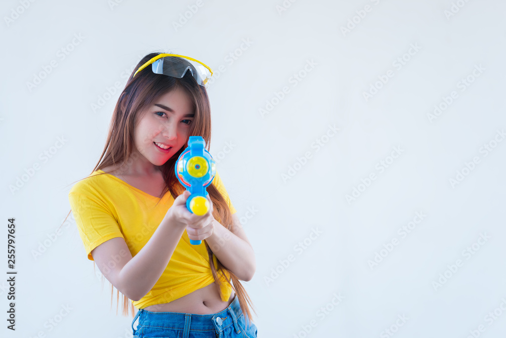 Asian sexy woman with water in hand on white background,Festival songkran day at thailand,The best of festival of thai,Land of smile Asian sexy woman with water in hand on white background,Festival songkran day at thailand,The best of festival of thai,Land of smile