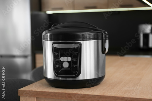 Modern multi cooker on table in kitchen