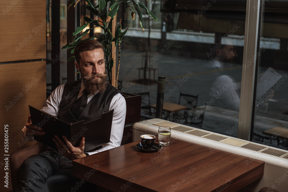 Bearded businessman with workbook Bearded businessman with workbook