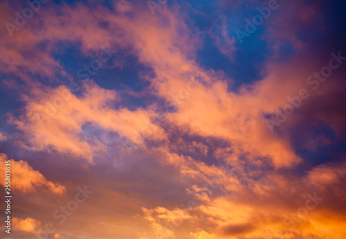 Dramatic sky with orange clouds at sunset