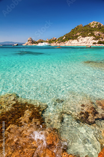 Fotografie Clear turquoise water of Cala Corsara in Sardinia Italy