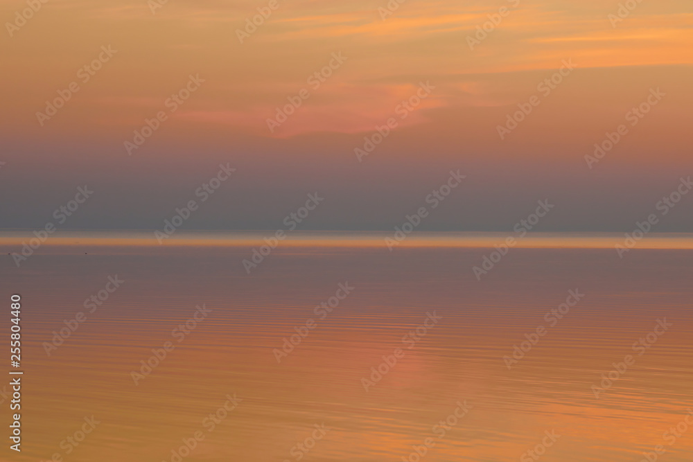 Beautiful clear background sunset color over the lake