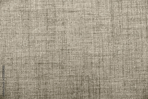 Hessian sackcloth burlap woven texture background / cotton woven fabric background with flecks of varying colors of beige and brown. with copy space. office desk concept.